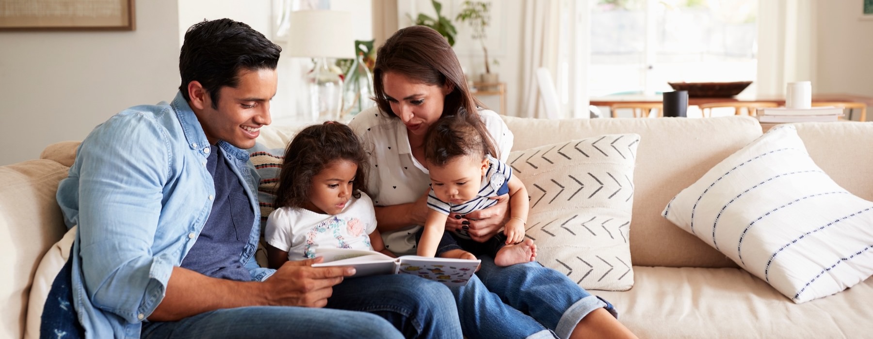a family sitting on a couch